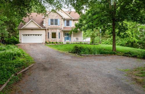 Louisa House | Secluded 3 Acre 5 BR Resort with a Private Heated Salt-Water Pool, Hot tub, Boat Dock, Sauna, and Game Room