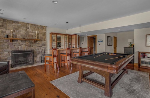 Huntly House | Secluded 4 bedroom log style home with screened porches, deck and fishing pond.