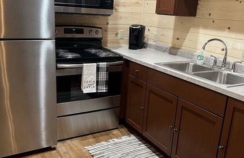 Logan Cabin | Secluded and close to all attractions. No cleaning fees!