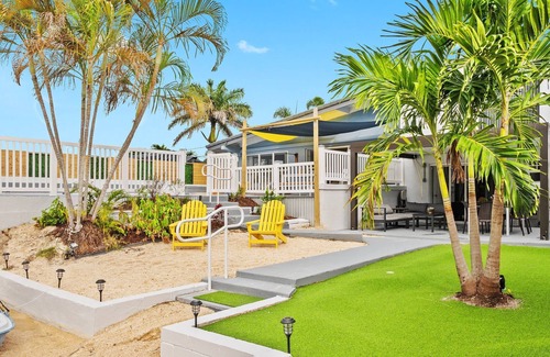 Lauderdale Isles House | Secluded Canal Sanctuary: Private Beach, Boat Dock, Pool, Mini-Golf Extravaganza