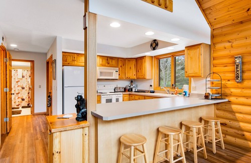 Friendship Cabin | Secluded, dog-friendly home with tree-lined view, firepit, fireplace, & deck
