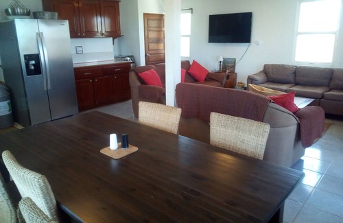 Caye Caulker House | Seculuded beachfront home, outdoor showers, rooftop deck, 360 island view