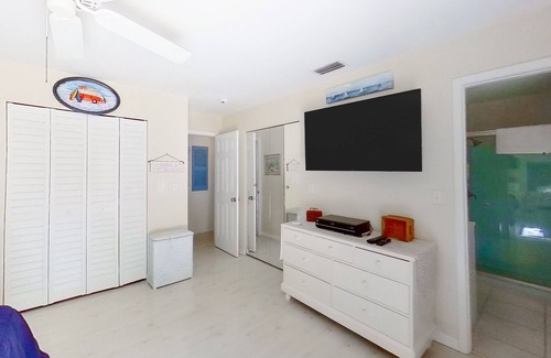 Bay Isle House | Siesta Key home with private pool, spa, fenced yard, screened lanai, & AC