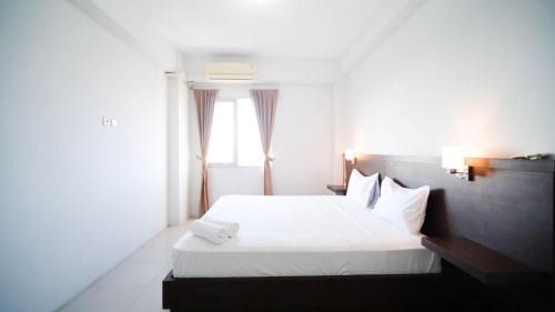 Surabaya Apartment | Simple 2BR with Extra Bed at Menara Rungkut Apartment By Travelio