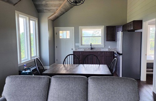 Brooks House | Small cottage house, centered on 100 acres surround by hills, lake, and cattle.