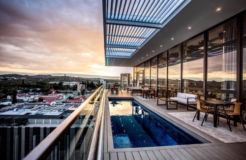 Windhoek Central Apartment | Soak Up the Sun by the Rooftop Pool! Onsite Spa, Parking, Short Walk to Zoo Park