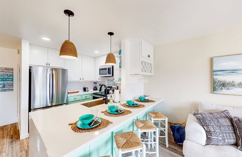 South Oceanside Condo | Sound view condo with modern interior, gas fireplace, balcony, & W/D access