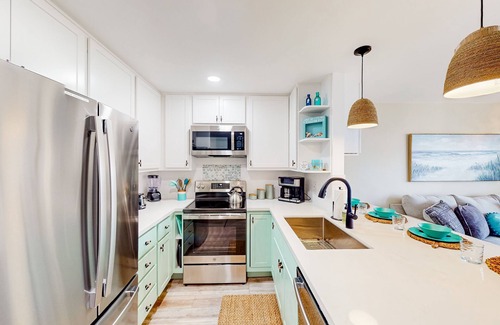 South Oceanside Condo | Sound view condo with modern interior, gas fireplace, balcony, & W/D access