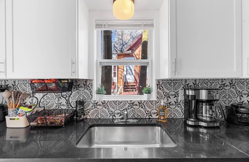 Lansing House | Spacious 4-bedrooms with 3 full showers, comfortable living room and dining