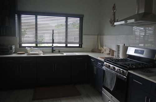 Tower Isle House | Spacious 6-bedroom house with WiFi and AC in charming St. Mary Parish