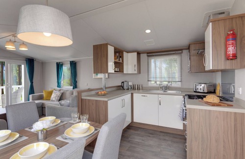 Axminster House | Spacious and luxurious 12ft-wide caravan with one double and two twin.