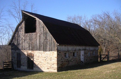 St. James House | Spacious but cozy farmstead lodge has stone fireplace and sleeping for 9 to 10