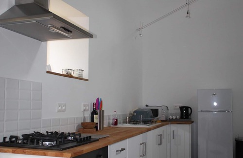 Soumeras House | Spacious, double height, beamed main space. This gite is in a rural setting.