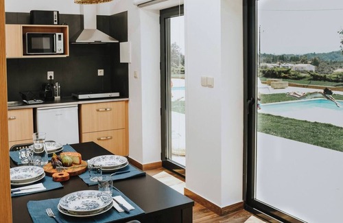 Peso Apartment | Spacious for 2 adults and 3 children, with mezzanine, star projector and baby kit (chair, crib, inflatable tub). Large window faces the pool, giving natural light, relaxing view and direct outdoor access—perfect for family comfort.
