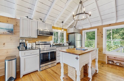 Union House | Spacious lakefront home with stunning views, hot tub, fire pit, dock & swimming