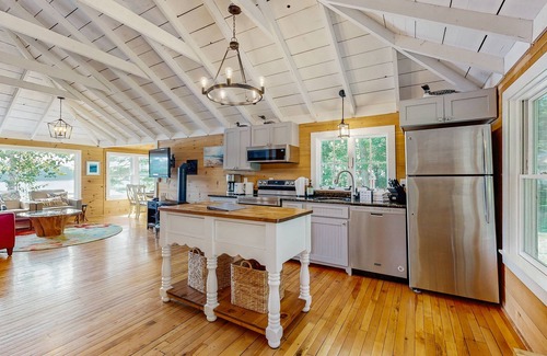Union House | Spacious lakefront home with stunning views, hot tub, fire pit, dock & swimming