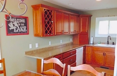 Fountain House | Spacious lakeside house on deep, all sports lake near Ludington & PM river