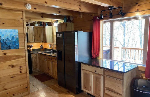 New Plymouth Cabin | Spacious Log Cabin with Hot Tub, Fire Pit, Large Decks & Wood Fireplace