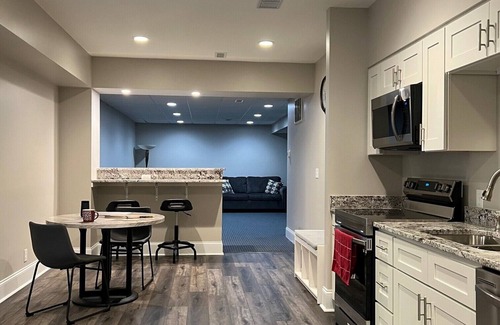 Concord Apartment | Spacious Split-Level, Basement Apt. w/Gorgeous Sunroom Overlooking Wooded Area.