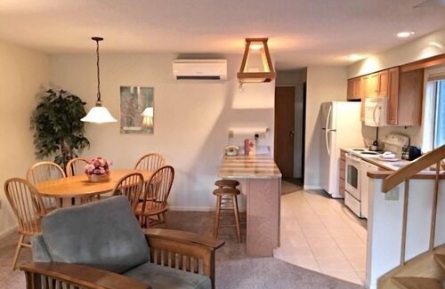 Bartlett Hotel | Spacious Two-Level Family Condominium Unit Featuring Full Kitchen, Private Balcony, Jetted Tub, and