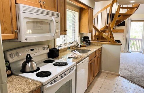 Bartlett Hotel | Spacious Two-Level Family Condominium Unit Featuring Full Kitchen, Private Balcony, Jetted Tub, and