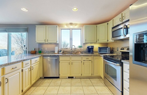 Sagamore Beach House | Spacious wooded retreat near canal & beach with deck & alfresco dining