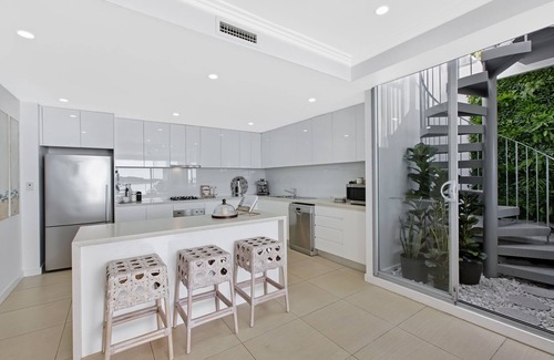The Entrance Apartment | Spiral staircase to 2 level rooftop Penthouse with Hot spa & BBQS