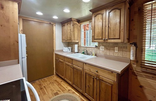 Island Park Cabin | Spruce Fly on Bill's Island! Enjoy four private bedrooms and 2 full bathrooms!