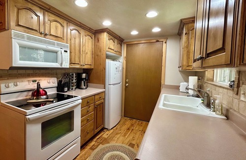 Island Park Cabin | Spruce Fly on Bill's Island! Enjoy four private bedrooms and 2 full bathrooms!