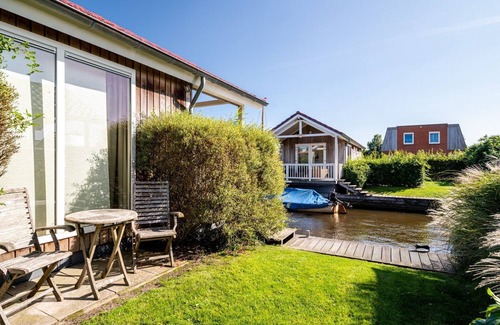 Akkrum House | Stay in our cozy Meine 4 luxury chalet with a private dock and sauna.
