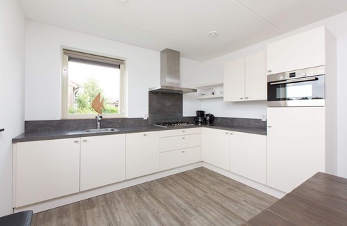 Akkrum House | Stay in our spacious Sneekermeer 6 home with private jetty.