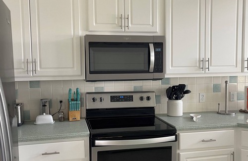 East End House | STAY SALTY~ Pool, Gorgeous Bay Views, In Town Center & Golf Cart Friendly Area.
