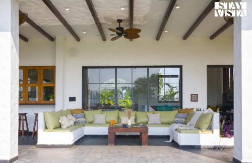 Rau Villa | StayVista at Lotus by the lake with Pool, BBQ & Lawn