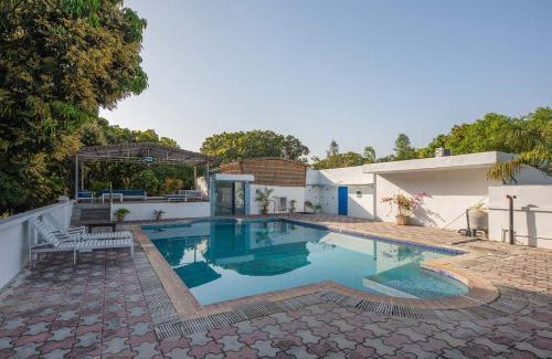 Roorkee Villa | StayVista at Mango Trails with Swimming Pool