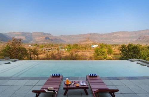 Mangaon Khurd Villa | StayVista's Basalt - with Mountain Views, Infinity Pool, Vintage Interiors, and Games Room