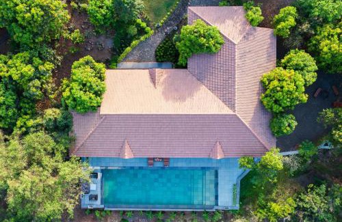 Mangaon Khurd Villa | StayVista's Basalt - with Mountain Views, Infinity Pool, Vintage Interiors, and Games Room