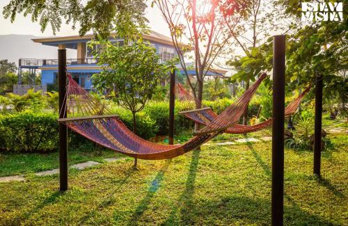 Vaijanath Villa | StayVista's Hillside Meadows - Mountainside Retreat with Farm View, Pool & Deck, Lawn & Gazebo