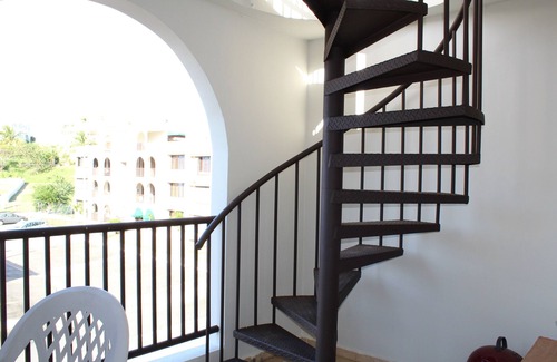 Hucares Condo | Steps away from a soft sand beach and warm waters