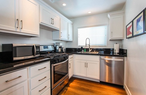 Balboa Peninsula Apartment | Steps to Beach and Bay with Garage Parking (compact car) & Air Conditioning!