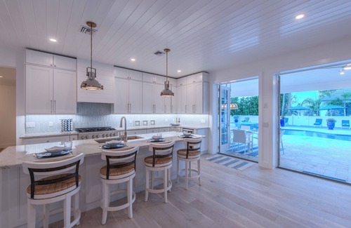 Connors House | Steps to Vanderbilt Beach, Sleeps 13, Resort-Style Backyard