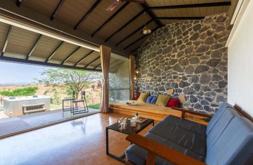Nashik Villa | Stone House Bezze by StayVista with Lake view, Jacuzzi & Lawn - your perfect getaway