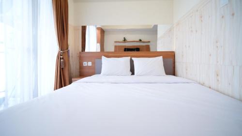 Surabaya Apartment | Strategic and Homey Studio at Tamasari Papilio Apartment By Travelio