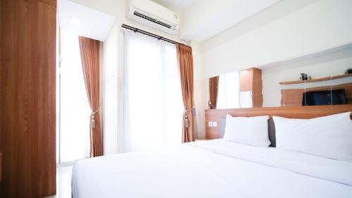 Surabaya Apartment | Strategic and Homey Studio at Tamasari Papilio Apartment By Travelio