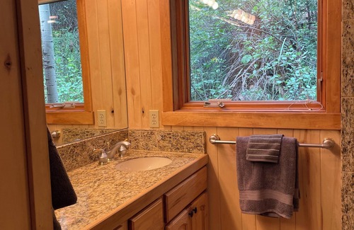 Lyons Cabin | Streamside Cabin nestled in Rock Canyon Walls with Creek flowing through it