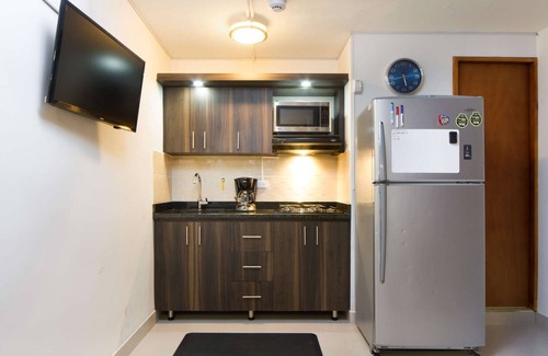 El Poblado Apartment | Studio AC, Hot Tub Two flat screens queen bed printer.