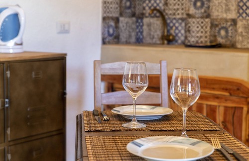 Trinita d'Agultu Apartment | Studio Apartment 'Stazzo Jana' with Sea View, Private Terrace and Air Conditioning