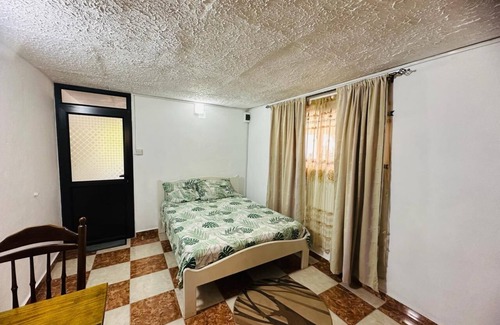 Candos Apartment | studio with 1 double bed, private bathroom with warm shower,free parking & wifi.