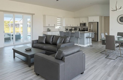 White Marsh House | Stunning Modern New Construction Home w/Pool, Canal Views, & BBQ