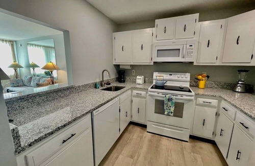 The Pines Condo | Stunning Ocean Views from Fifth-Floor Condo with Pool & Off-Street Parking!