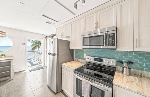 Orlando Beach Condo | Stunning Riverfront Balcony Views! W/Private Beach Access & Perfect Setting for Events